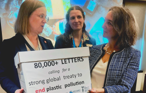 Karen Wirsig from Environmental Defense Canada and MP Julie Dabrusin holding a box labelled "80,000+ Letters" with Lisa Gue from David Suzuki Foundation standing behind