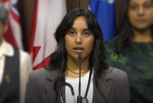 Photo of CAPE Board Member, Dr. Sehjal Bhargava speaking at a press conference in Ottawa