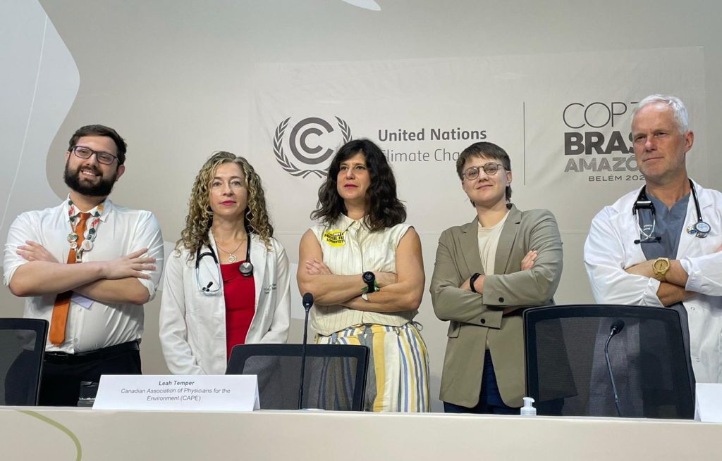 Gustavo Dalle Cort, Courtney Howard, Leah Temper, Gill Asynski, and Joe Vipond stand with harms crossed at a COP30 press conference